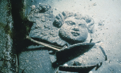 Wooden carved cherub in situ at the historic wreck off Duart Point during investigations by the Archaeological Diving Unit (ADU) (© Crown Copyright HES)
