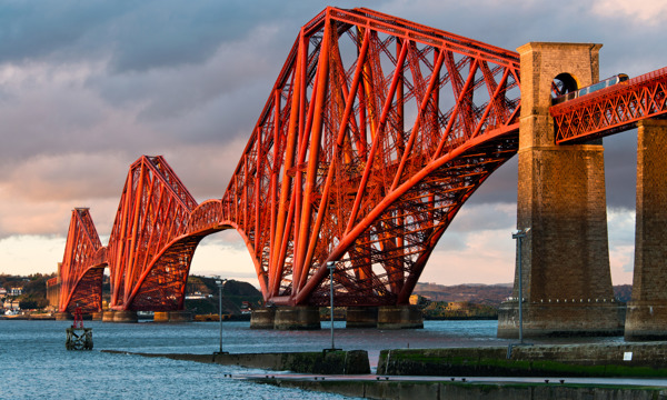 The Forth Bridge, seen across the Forth towards Queensferry.