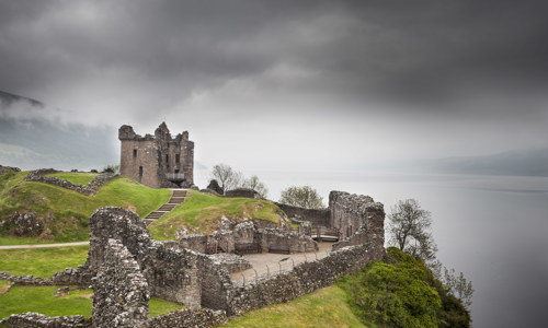 Urquhart Castle and Loch Ness on a foggy day.