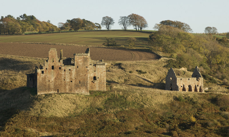 Crichton Castle, as seen on its hillside terrace from across the River Tyne