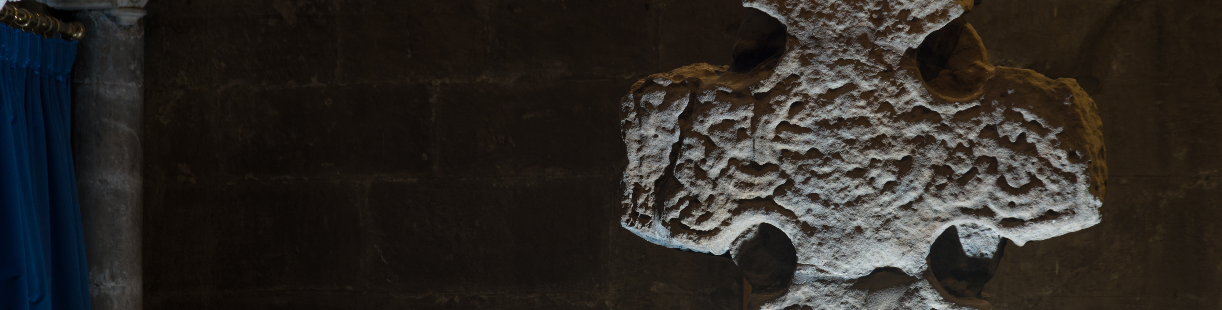A detailed shot of a carved stone cross
