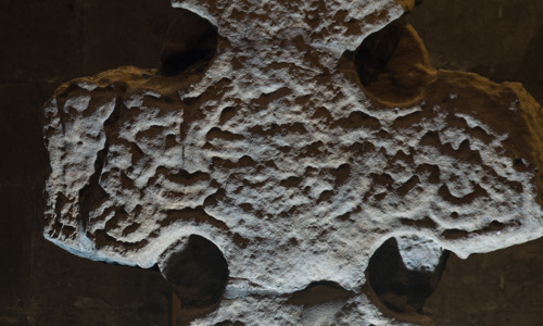 A detailed shot of a carved stone cross