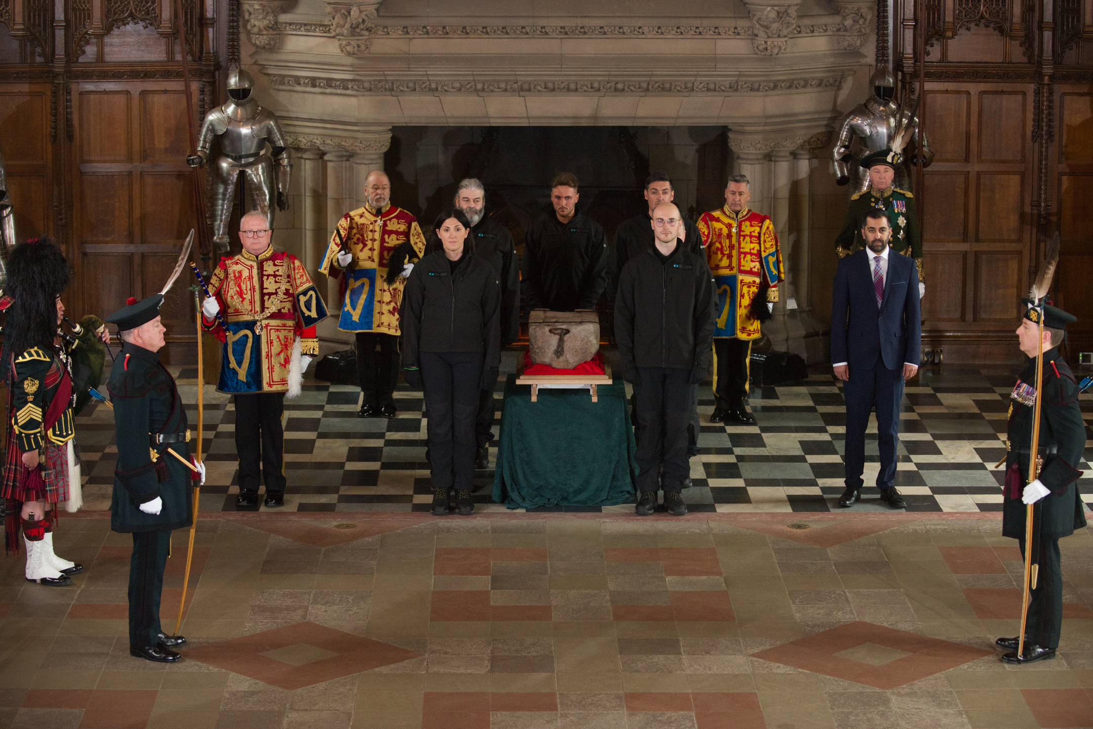 HES staff Carrying the Stone of Destiny at the ceremony at Edinburgh Castle's Great Hall