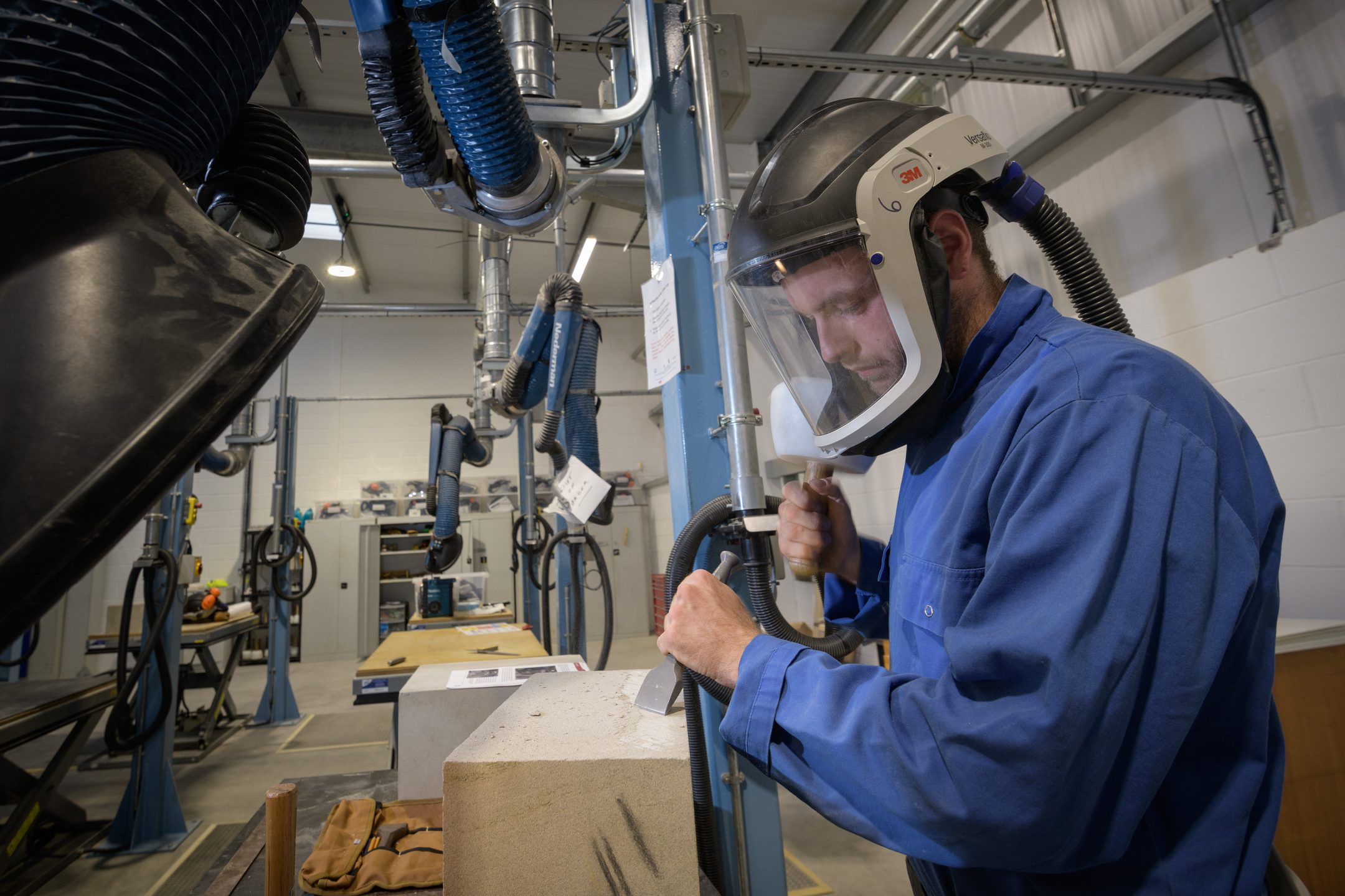 A stonemason working in a skills centre 