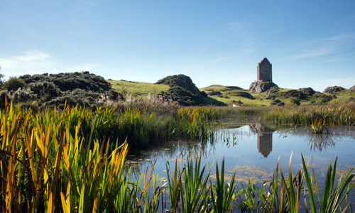 A distant view of Smailholm Tower.
