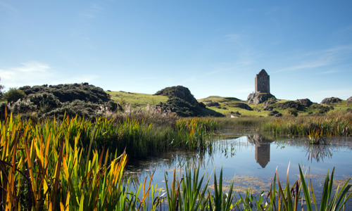 A distant view of Smailholm Tower.