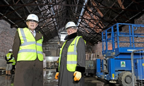 Two people in safety equipment inspect construction work at the site of the Engine Shed in Stirling.