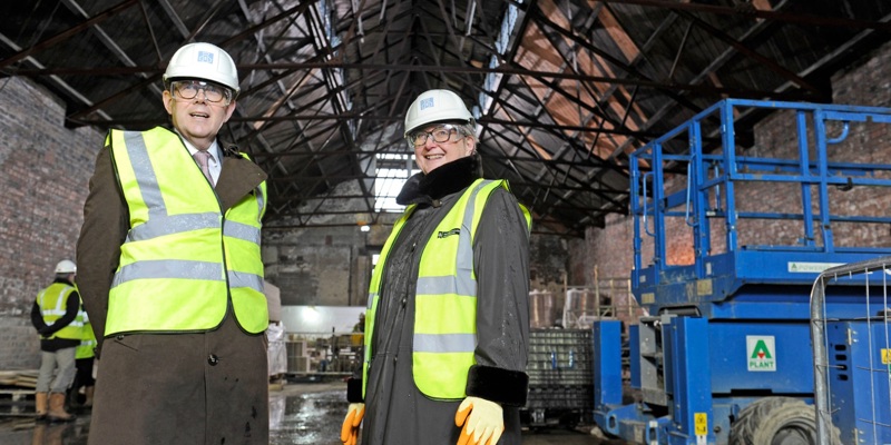 Two people in safety equipment inspect construction work at the site of the Engine Shed in Stirling.