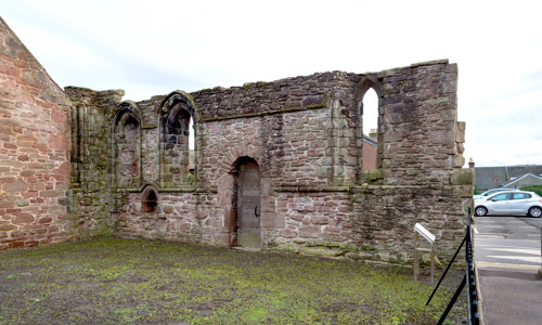 A solitary wall, all that remains of Maison Dieu
