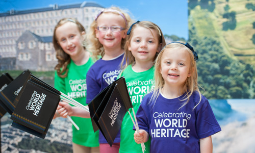 A group of children celebrating World Heritage Day.