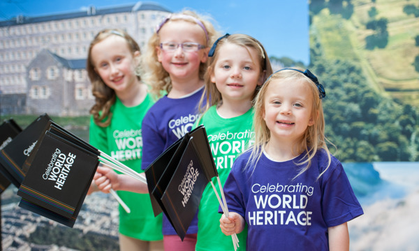A group of children celebrating World Heritage Day.