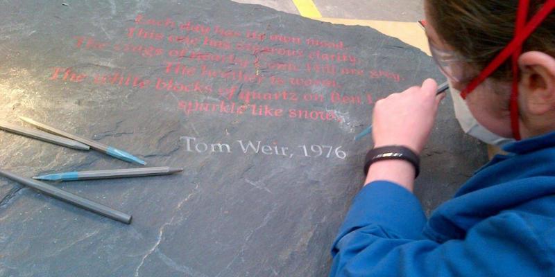 Tom Weir quotation carved into black stone