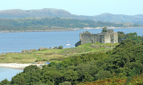 Distant view of Castle Sween with Loch Sween and the hills in the background