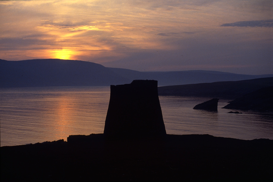 Mousa Broch at sunset with the North Sea and the Shetlands in the background