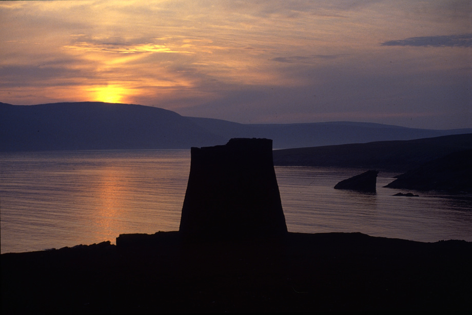 Mousa Broch at sunset with the North Sea and the Shetlands in the background