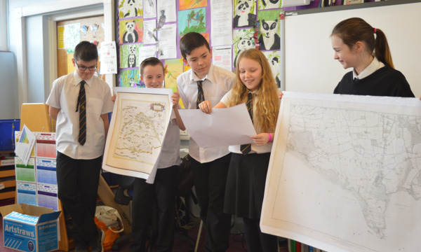 School pupils showcasing maps at Rosyth