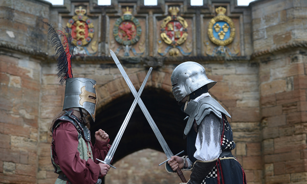 Two knights with crossed swords at the entrance to Linlithgow Palace