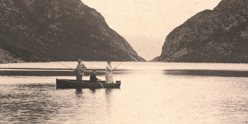  Photograph from an album from  around 1880 showing visitors fishing on Loch Beinn Taighe, Eigg. The image is labelled, Loch where we caught a fish.