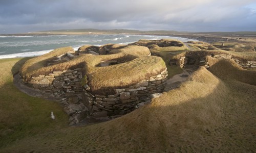 Skara Brae House with the waves in the background