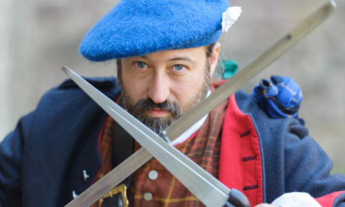 Costumed performer dressed as a Jacobite soldier