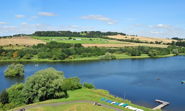 Linlothgow Loch with pier, and surrounding grass land and farms