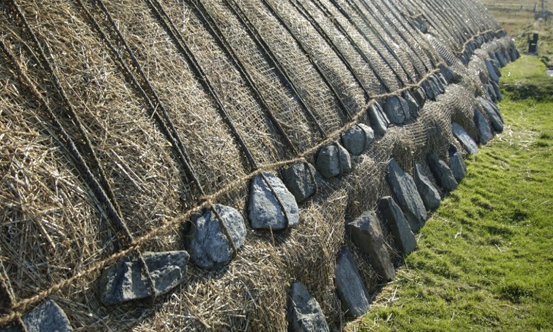 The side of the Blackhouse at Arnol, showing the roof weights holding down the thatched roof