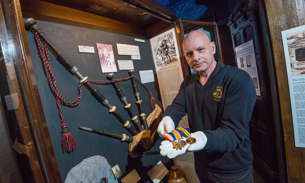 Rod MacKenzie of the Argyll and Sutherland Highlanders Museum with Willie Lawrie's bagpipes