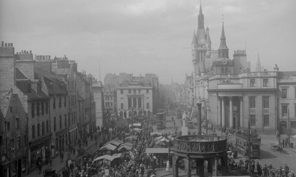 1920s black and white photo of Castle Street in Aberdeen with busy market