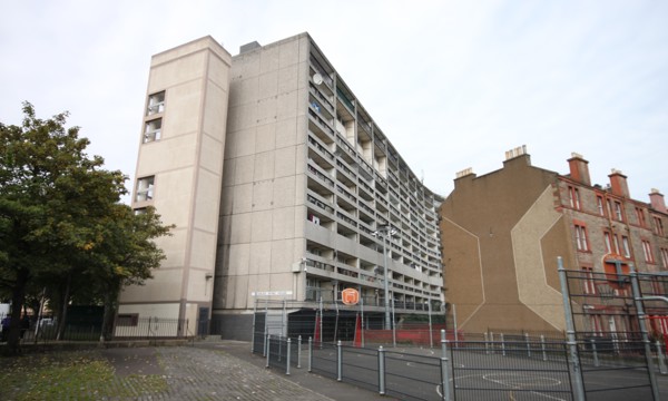 Side view of Cables Wynd House (aka "Banana Flats") in Leith, Edinburgh, with a basketball court also in the frame