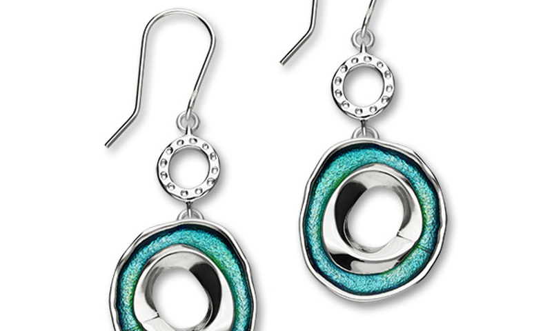 Silver earrings with circular turquoise gems, with additional silver circles at the top