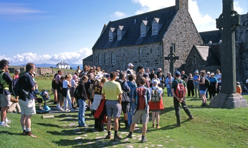 The community in Iona gathered around St. John's Cross