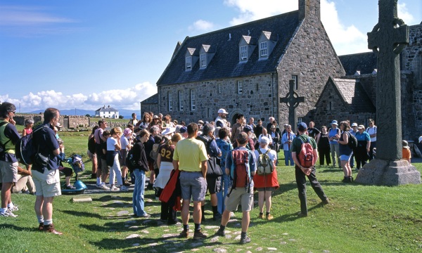 The community in Iona gathered around St. John's Cross