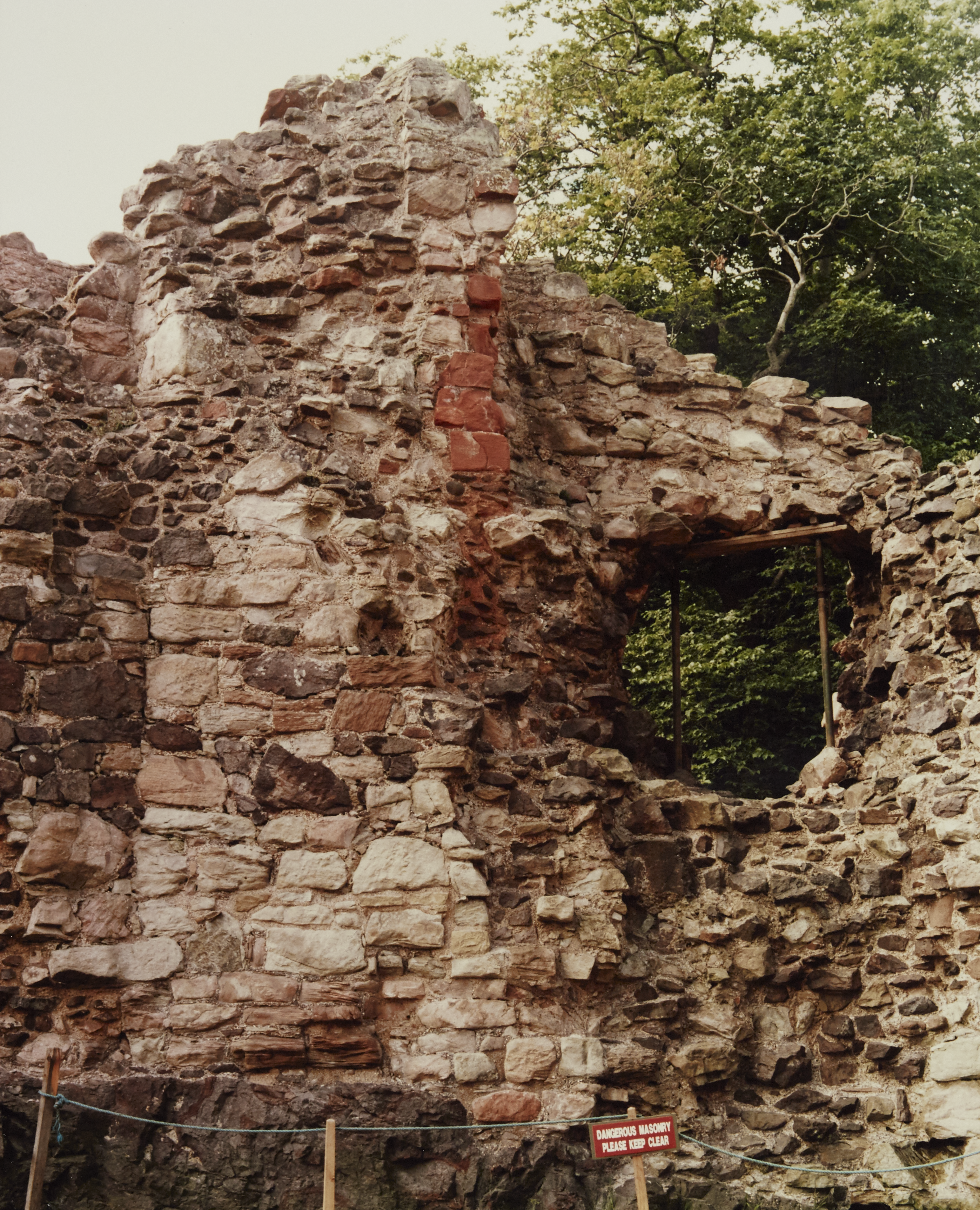 A wall section with a large hole in it 
