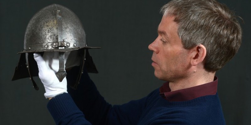 Hugh Morrison, Collections Registrar at Historic Environment Scotland, packing a 17th Century helmet from Dumbarton Castle to go on display at Nanjing Musuem as part of the Romantic Scotland exhibition 