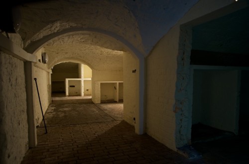 An empty hallway in an underground vault