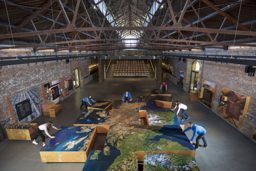 Staff at the Engine Shed assembling a large interactive map of Scotland.