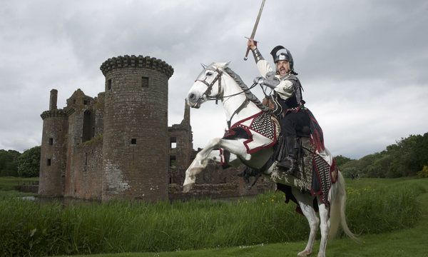 A jouster on a horse wielding a sword