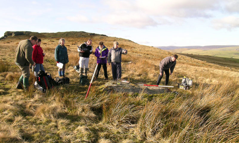 Photograph of a group of researchers carrying out some field work