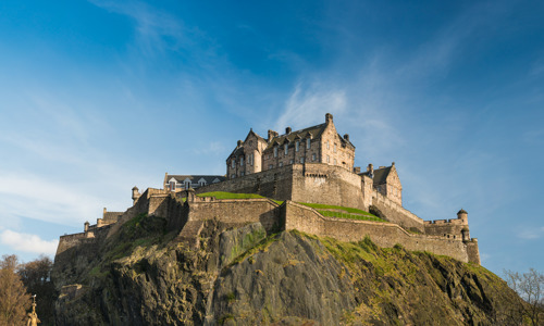 castle on a rock with blue sky above