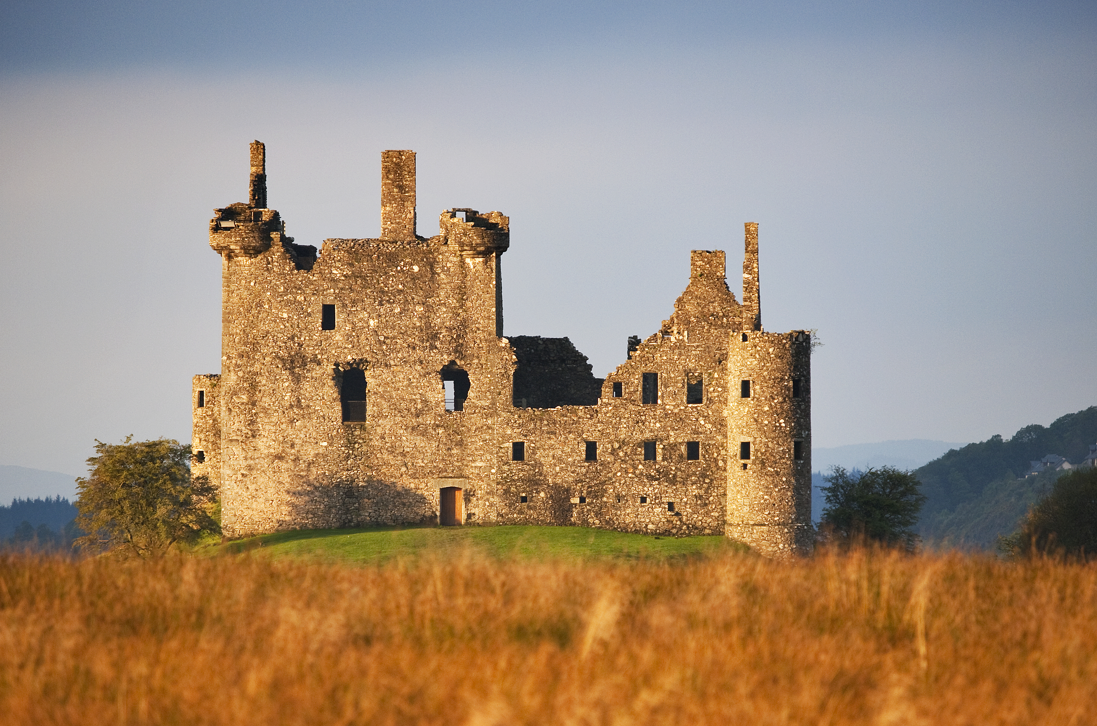 Large castle ruin on top of a hill