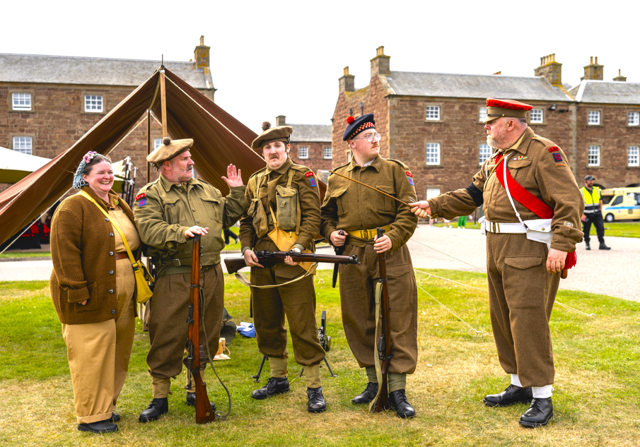 World War 2 reenactors pose as part of Celebration of the Centuries event at Fort George