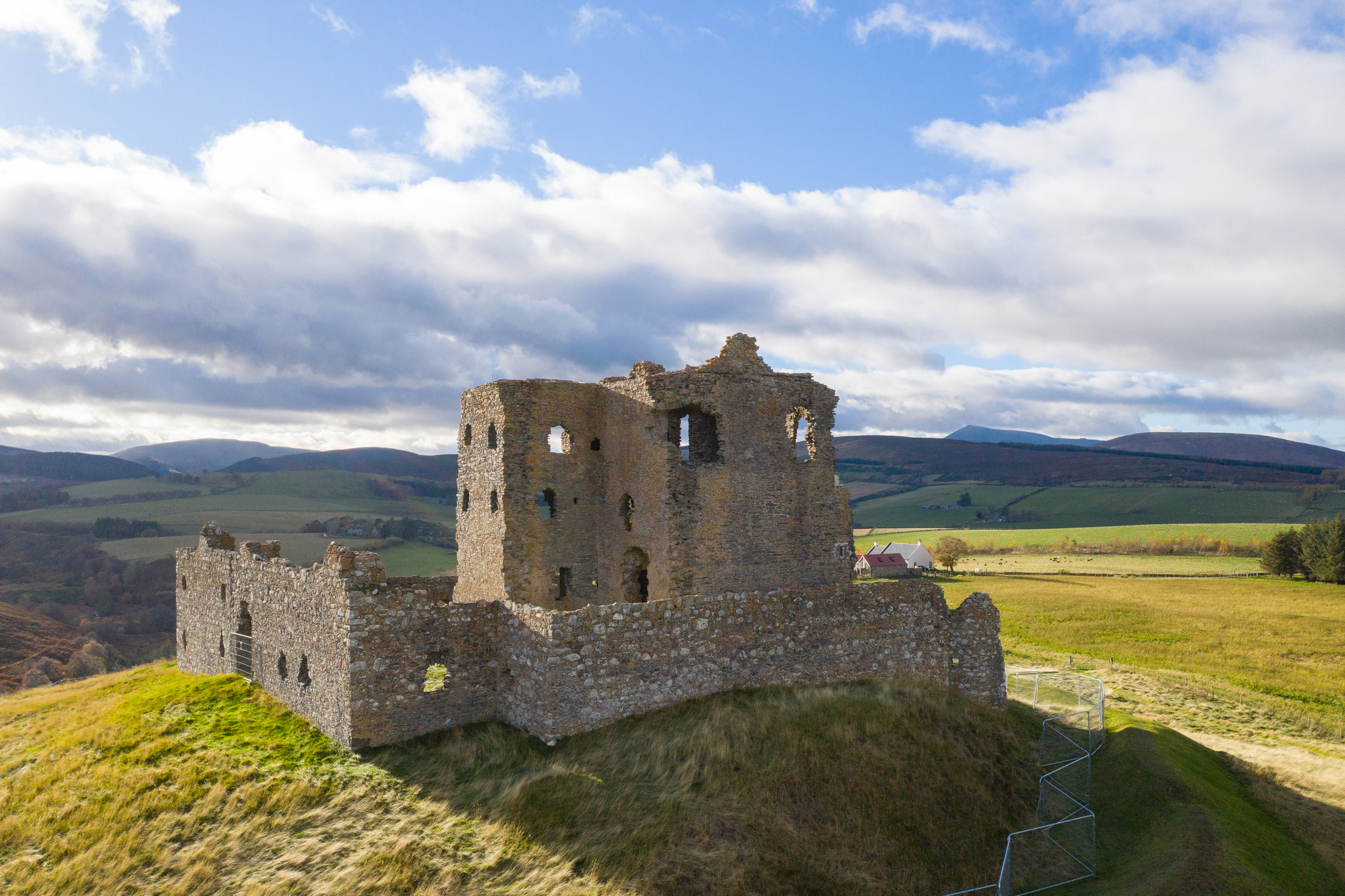 Sunshine on the ruins of Auchindoun Castle situated in a remote Highland landscpe