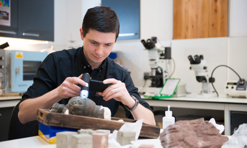 Callum Graham, Laboratory Scientist based at the Engine Shed delivering a stone conservation workshop