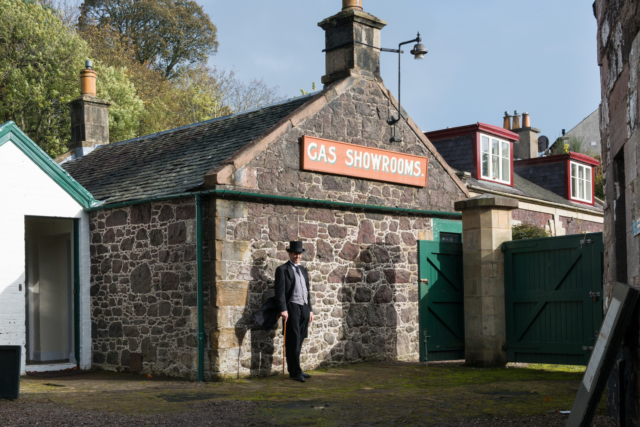 Historic gas showroom with a historical reenactor outside.