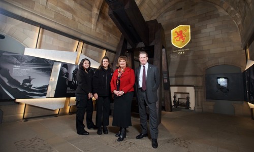 Fiona Hyslop and Alex Paterson with HES Modern Apprentices, Ellen Denholm and Lucy McLean at the new exhibition in the Argyle Tower, Edinburgh Castle