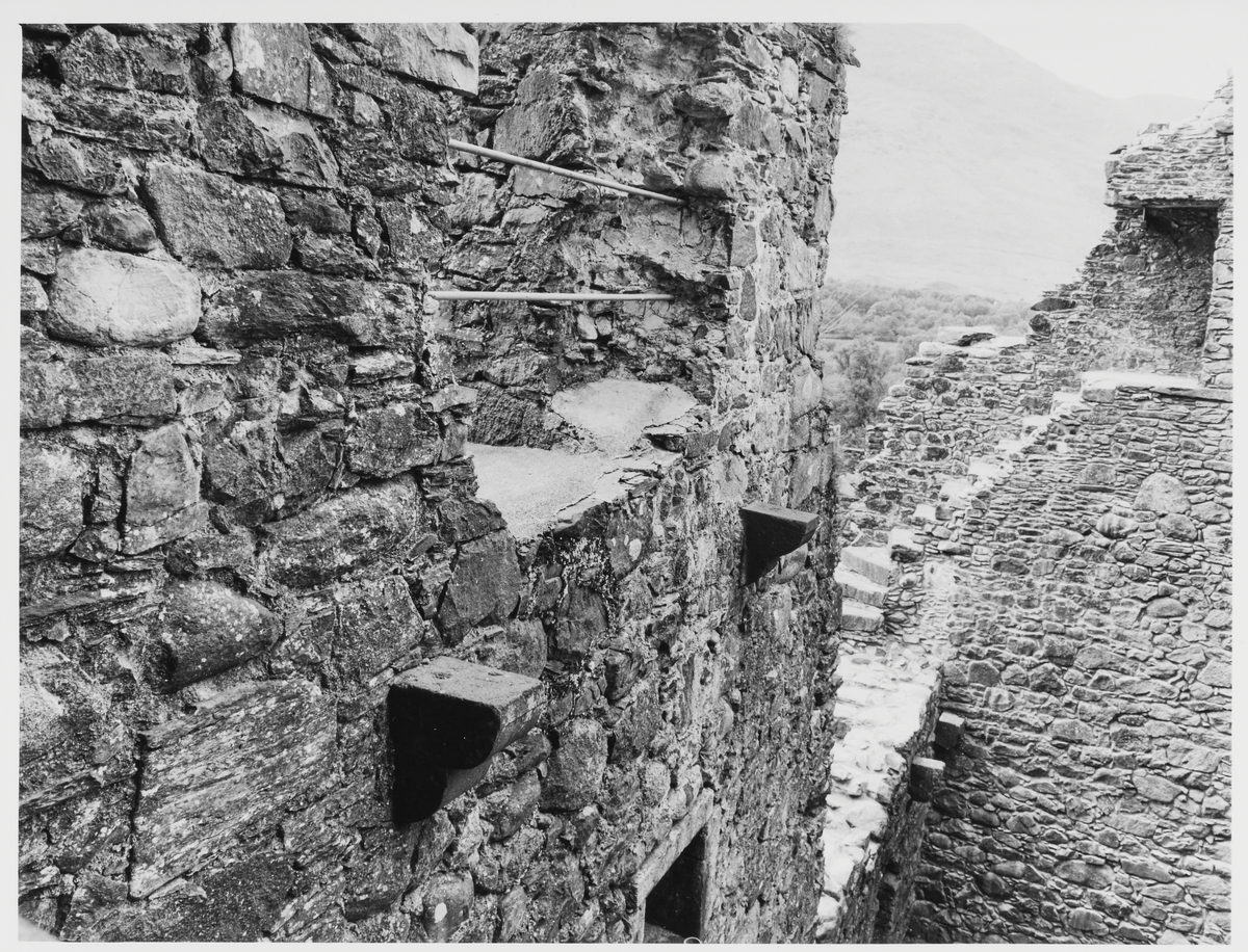 Close-up view of high section of wall, showing where another floor and an entrance way may have been