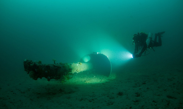 Diver exploring a section of mast from a German battleship courtesy Bob Anderson