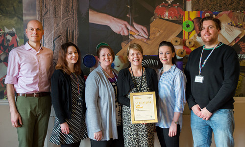 Some HES staff with the Gold Award accreditation