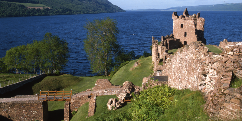 Urquhart Castle in summer with Loch Ness in the background