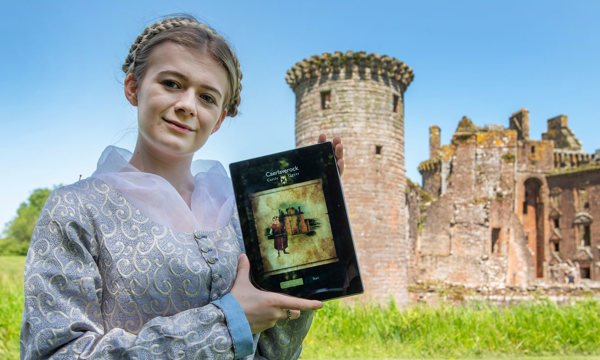 Costumed performer outside Caerlaverock Castle promoting the new Castle Quest app